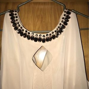 Cream colored dress.